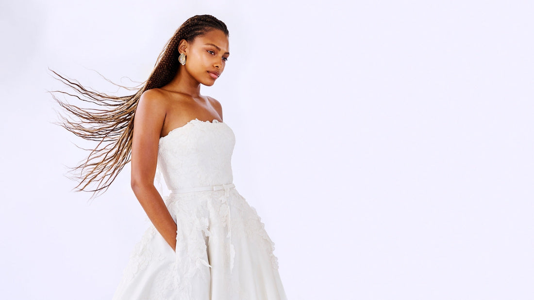 Bride wearing a minimalist wedding dress with a clean sheath silhouette by Houghton